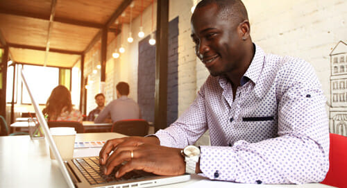 man searching for jobs on laptop